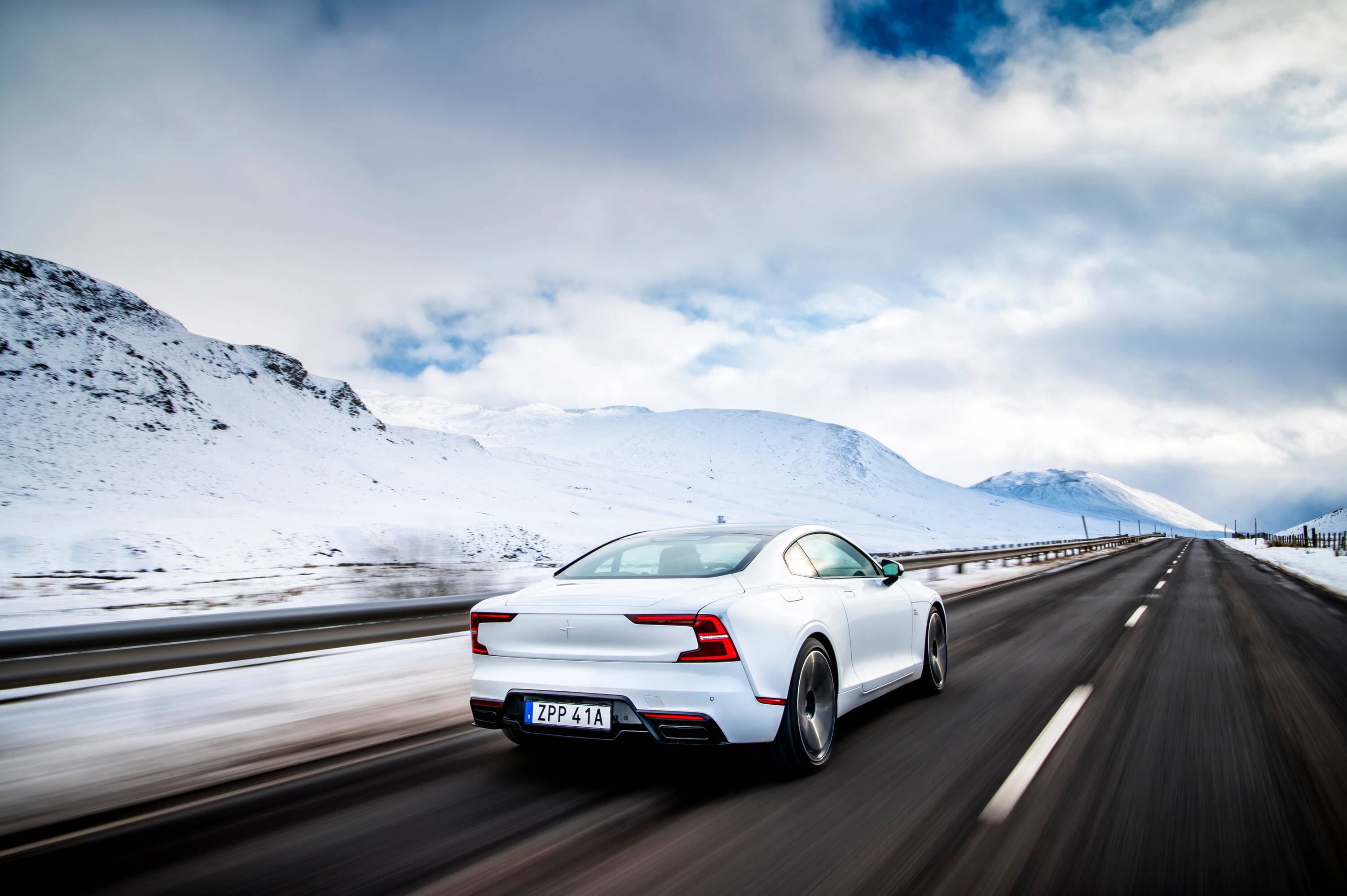 Polestar electric car exterior rear driving in snow