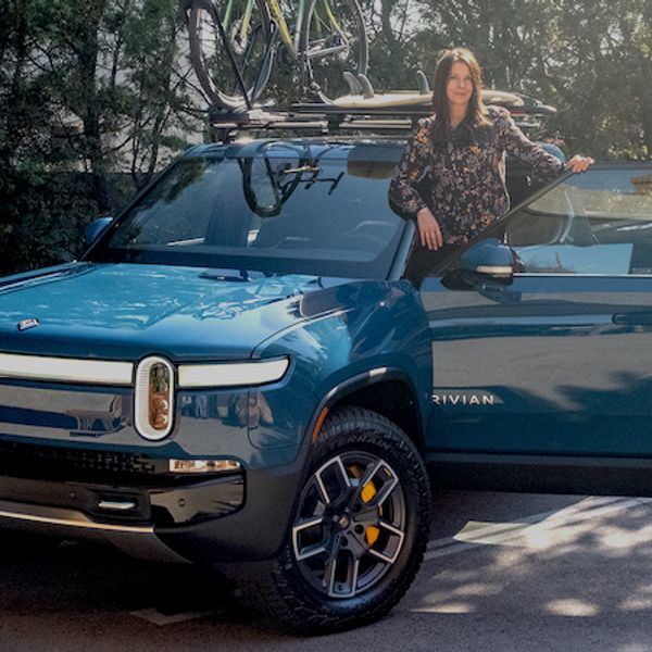 Rivian R1T in blue with Ginny Buckley